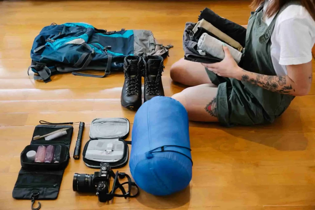 A complete mindful roaming gear system fitted pack, hardshell jacket, minimalist boots, titanium cup, single navigation device, embodying use without being used