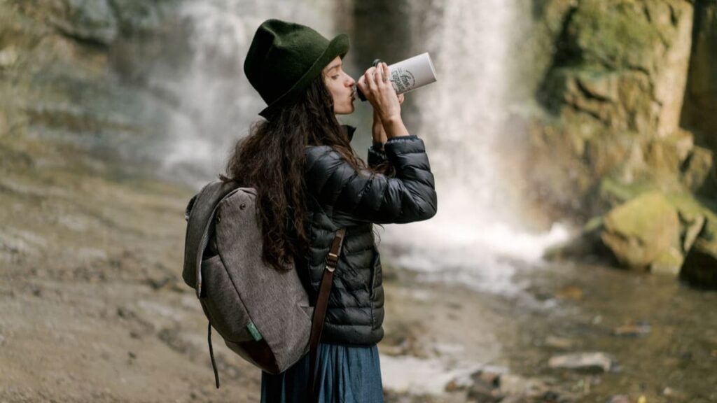 backcountry water filter — the device that serves the hiker by finding water already in the landscape, filtering it in the hiker's hands, and returning it to the body without a second vessel, a separate ritual, or a mechanism to attend to.