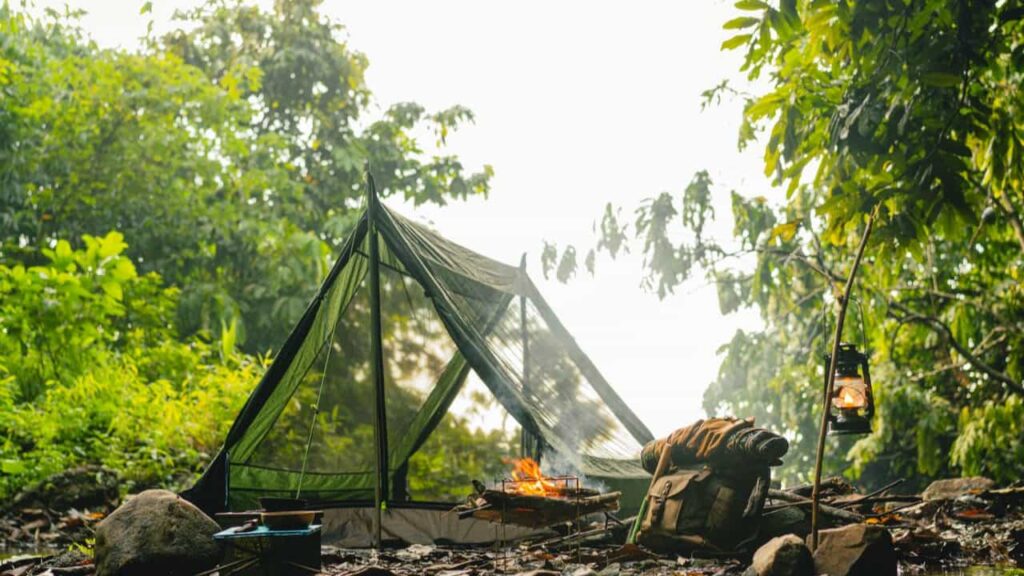 minimalist backpacking tent — the shelter that serves the body by protecting the space the body fills, not by claiming space for the fabric.